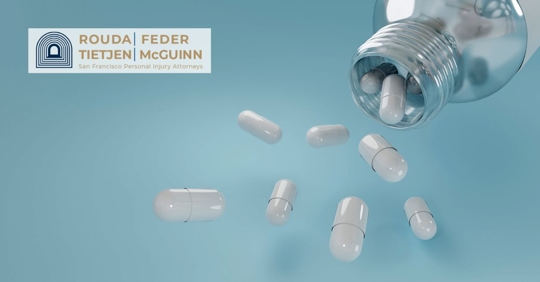 Pills spilling out of a bottle.